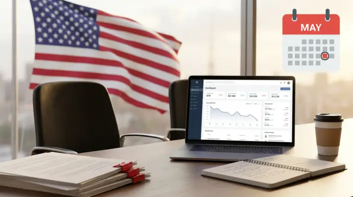 office desk with laptop, american flag, and may calendar, highlighting memorial day hiring gaps.